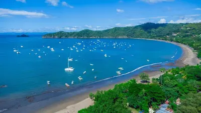 an aerial view of a beach with boats in the water at Beautiful and comfortable Two Bedrooms Beach Condo in Coco
