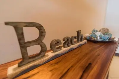 a wooden sign that says beta on top of a table at Playa Flamingo, Stunning Sunset View Condominium Flamingo Towers 17 in Playa Flamingo