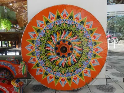 a colorful mandala artwork on display in a store at Cabañas Valle Campanas - Monteverde, Costa Rica in Monteverde Costa Rica
