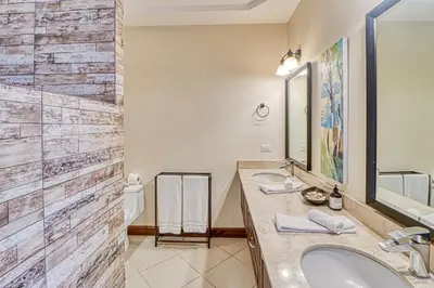 a bathroom with a sink and a mirror at Canto del Mar #20 in Dominical