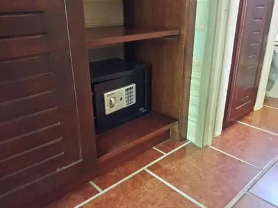 a microwave oven sitting inside of a cabinet at Ocean Melody 2 in Uvita