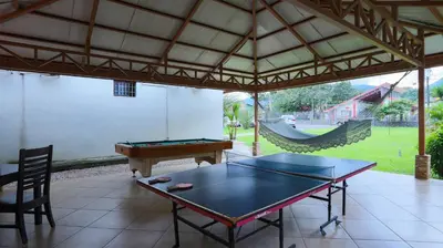 a ping pong table in a pavilion with a pool table at Condo's Vista Al Volcan in Fortuna