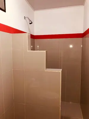 a bathroom with a shower with a glass door at Millenium Manuel Antonio Park and beach in Manuel Antonio