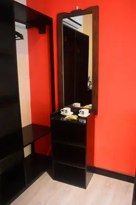 a bathroom with a black vanity and a mirror at Millenium Manuel Antonio Park and beach in Manuel Antonio
