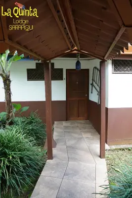 a entrance to a building with a wooden door at La Quinta Sarapiqui Lodge in Sarapiquí