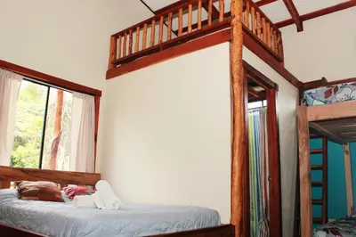 a bedroom with two bunk beds in a room at Pension Santa Elena in Monteverde Costa Rica