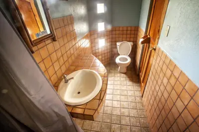 a bathroom with a sink and a toilet at Pension Santa Elena in Monteverde Costa Rica