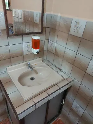 a bathroom with a sink and a mirror at Hotel Torre Fuerte in Venecia