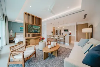 a living room with a couch and a table at Las Villas Marina Pez Vela in Quepos