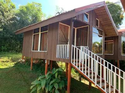 a house with a staircase leading up to it at Hotel Palenque Tarrazu in San Marcos