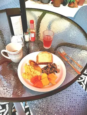 a plate of breakfast food on a table at Hotel Villa Prats in Manuel Antonio
