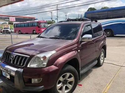 a purple suv parked in a parking lot at Lemon House Monteverde in Monteverde Costa Rica