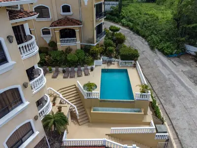 an aerial view of a house with a swimming pool at Playa Flamingo penthouse with pacific sunset views - Flamingo Rose Vista in Playa Flamingo