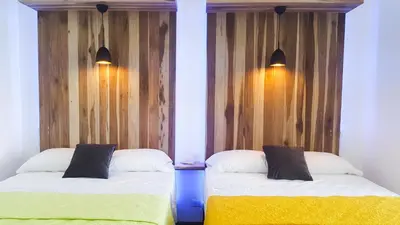 two beds sitting next to each other in a room at Pura Vista Hotel in Ocotal