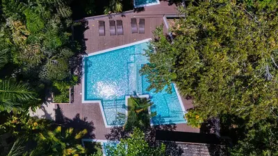 an overhead view of a swimming pool with trees at Elan at Ballena Beach in Uvita