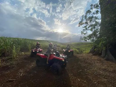 a group of people riding atvs on a dirt trail at Hotel Villa Florencia in Turrialba