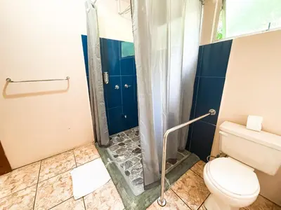 a bathroom with a shower and a toilet at La Casa de la Montaña in Monteverde Costa Rica