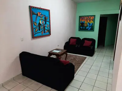 a living room with a couch and a table at Arenal Xilopalo in Fortuna