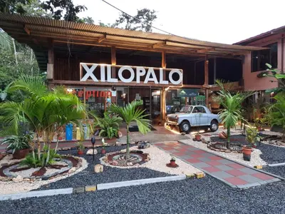 a car parked in front of a building at Arenal Xilopalo in Fortuna