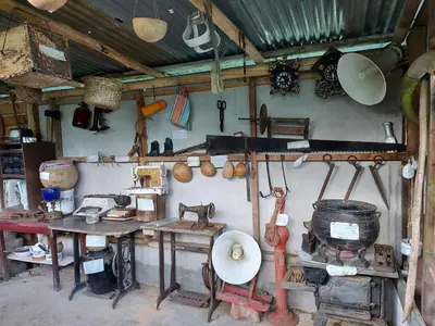 a kitchen with a bunch of items on the wall at Posada Rural Oasis in Caño Negro