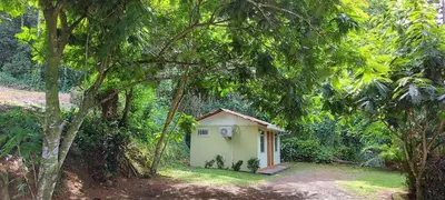 a small house in the middle of a forest at Hostal y cabinas anita-and rafting tour! in Siquirres