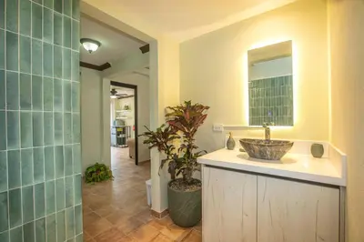 a bathroom with a sink and a mirror at Green Villas El Coco in Coco