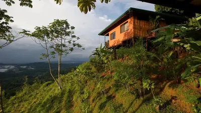 a house on the side of a hill at Santa Juana Lodge & Nature Reserve in Quepos