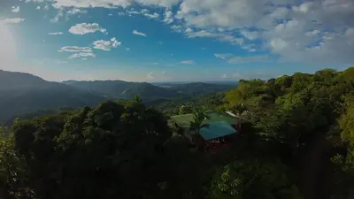 an aerial view of a house in the middle of a forest at Santa Juana Lodge & Nature Reserve in Quepos