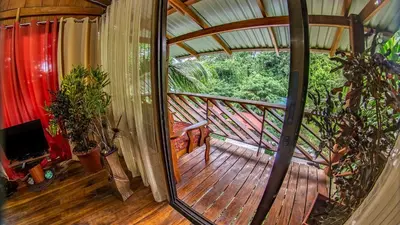 an inside view of a house with a wooden deck at Cabañas del Lago in Fortuna