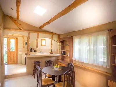 a kitchen and dining room with a table and chairs at La Cima del Mundo in Chimirol