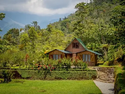 a small house in the middle of a garden at La Cima del Mundo in Chimirol