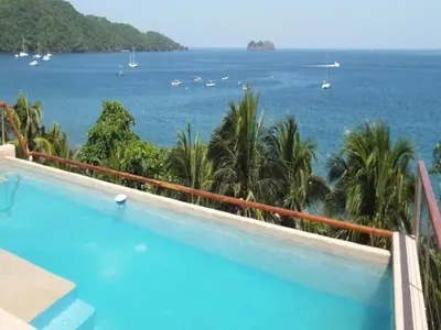 a swimming pool with a view of the ocean at Hotel La Gaviota Tropical in Playa Hermosa