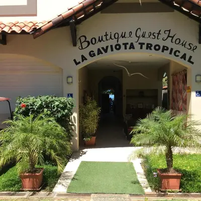 a building with a sign that reads boutique guest house laevructuri at Hotel La Gaviota Tropical in Playa Hermosa