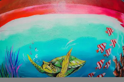 a painting of a turtle swimming in the ocean at Hotel Sol Puntarenas in Puntarenas
