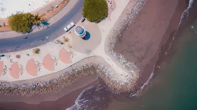 an overhead view of a beach with umbrellas at Hotel Sol Puntarenas in Puntarenas