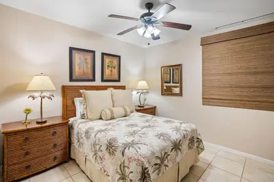 a bedroom with a bed and a ceiling fan at Ground-Floor Unit in Front of Lazy River Pool at Pacifico in Coco in Coco