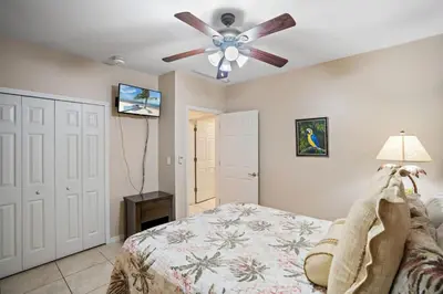 a bedroom with a ceiling fan and a bed at Ground-Floor Unit in Front of Lazy River Pool at Pacifico in Coco in Coco
