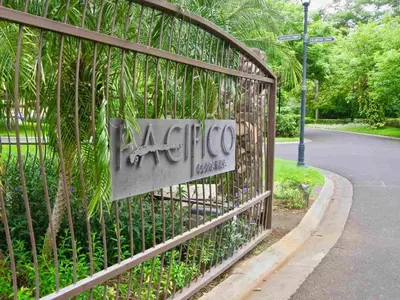 a metal fence with a sign on it at 1-Bedroom Near Pool in Coco