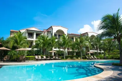 a swimming pool in front of a resort at Nicely Decorated 3rd-Floor Beauty with Pool-View Balcony in Coco in Coco