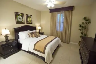 a bedroom with a large bed and a window at Third-Floor Oceanview Condo with Access to Sparkling Pool, Hot Tub & Beach Club in Coco