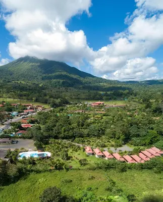 an aerial view of a village in front of a mountain at Hotel Volcan Verde in Fortuna