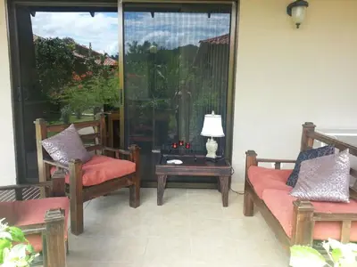 a living room with two chairs and a table at Casa Claudia in Potrero