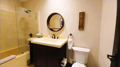 a bathroom with a sink and a toilet and a mirror at Las Catalinas Loft - for up to 4 people just steps from the beach in Playa Danta