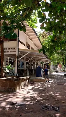 a person walking in front of a building at Las Catalinas Loft - for up to 4 people just steps from the beach in Playa Danta