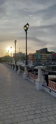 a row of benches with street lights on a pier at Las Catalinas Loft - for up to 4 people just steps from the beach in Playa Danta