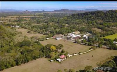 an aerial view of a house in a field at Casa Cora Bed and Breakfast in Colonia Carmona