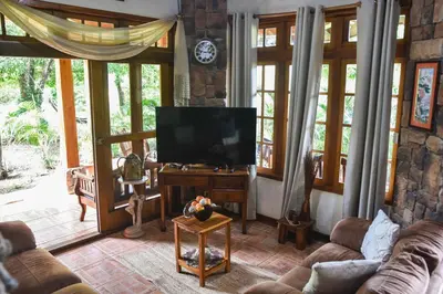 a living room with a tv and a couch at Casa Cora Bed and Breakfast in Colonia Carmona