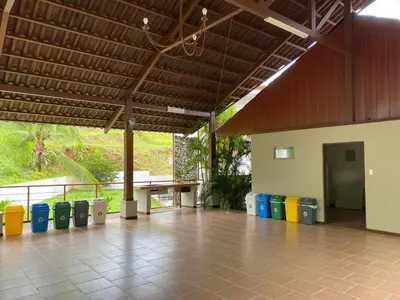 a room with a row of colorful trash cans at Punta Leona Beach Condos in Jacó
