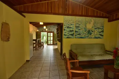 a living room with a couch and a table at Mirador House Cozy & Private Home W Volcano View in El Castillo de la Fortuna