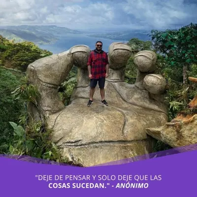 a man standing on top of a rock at Mirador House Cozy & Private Home W Volcano View in El Castillo de la Fortuna